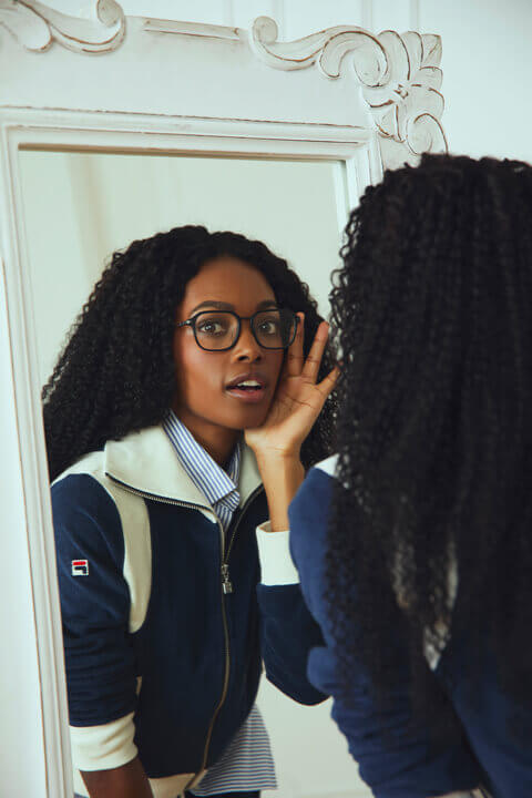 Woman smiling and wearing Heritage collection eyeglasses.