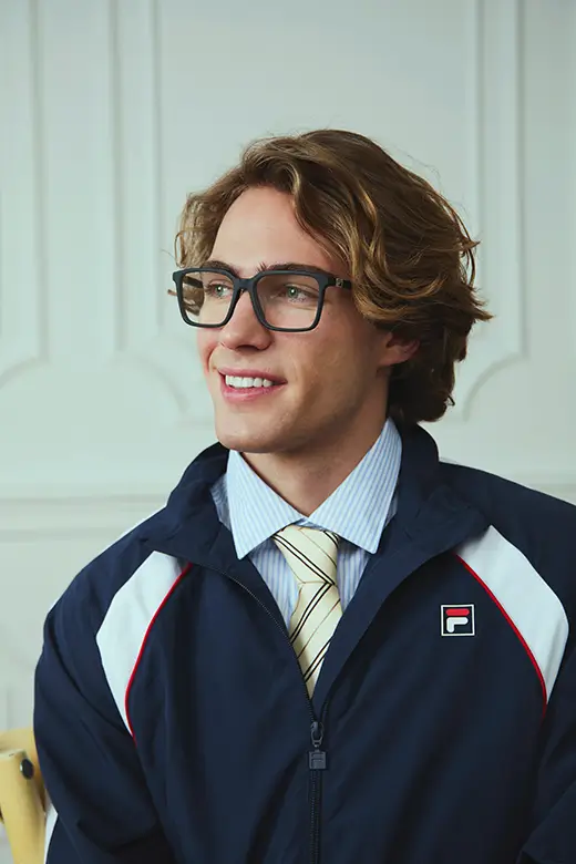 Man and woman wearing sunglasses with black standard lenses.